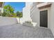 Private outdoor patio area with paved brick, a modern minimalist design, and a planter box at 1412 S Moody Ave # A, Tampa, FL 33629