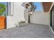 Private outdoor patio with paved brick and white walls. Modern exterior design at 1412 S Moody Ave # A, Tampa, FL 33629