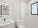 The bathroom features white subway tile, white vanity, white marble countertop, and a modern black faucet at 1412 S Moody Ave # A, Tampa, FL 33629