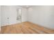 Bright room with hardwood floors and access to another room with a marble shower at 1412 S Moody Ave # A, Tampa, FL 33629