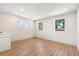 Empty bonus room with hardwood floors and three windows, including wet bar area in the corner at 1412 S Moody Ave # A, Tampa, FL 33629