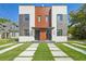 Modern townhome with sleek architectural design, professional landscaping, and inviting curb appeal at 1412 S Moody Ave # A, Tampa, FL 33629