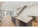 Contemporary kitchen with large island, stainless steel appliances, and light hardwood floors at 1412 S Moody Ave # A, Tampa, FL 33629