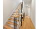 Modern staircase with wooden treads, metal railings, and cable accents, adding architectural flair at 1412 S Moody Ave # A, Tampa, FL 33629