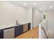 Hallway wet bar area complete with dark cabinetry, stainless steel appliances, and marble countertops at 1412 S Moody Ave # A, Tampa, FL 33629