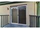 Private balcony accessible through sliding glass doors at 1799 N Highland Ave # 28, Clearwater, FL 33755