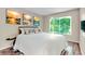 Inviting bedroom with lots of natural light, wood-style floors, and calming decor at 1799 N Highland Ave # 28, Clearwater, FL 33755