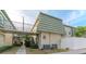 Building exterior showcasing walkway, landscaping, and building features at 1799 N Highland Ave # 28, Clearwater, FL 33755