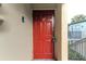 Red front door with keypad entry for added security at 1799 N Highland Ave # 28, Clearwater, FL 33755