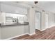 Kitchen with granite countertops and white cabinets at 1799 N Highland Ave # 28, Clearwater, FL 33755