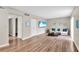 Spacious living room with wood-style flooring, comfortable seating, and a TV at 1799 N Highland Ave # 28, Clearwater, FL 33755