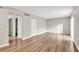 Bright living room with wood-look floors and large windows at 1799 N Highland Ave # 28, Clearwater, FL 33755