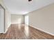 Living room with wood-look floors and access to balcony at 1799 N Highland Ave # 28, Clearwater, FL 33755