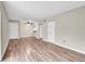 Spacious living area featuring wood-look floors and neutral walls at 1799 N Highland Ave # 28, Clearwater, FL 33755