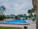 Inviting community pool with surrounding patio furniture at 1799 N Highland Ave # 28, Clearwater, FL 33755