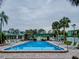 Refreshing community pool with lounge chairs and patio area at 1799 N Highland Ave # 28, Clearwater, FL 33755