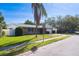 Brick ranch house with attached garage and street view at 1815 Elmhurst Dr, Clearwater, FL 33765