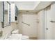 Small bathroom with shower, toilet and vanity at 2456 Tradewinds Dr, Dunedin, FL 34698