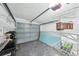 Garage with shelving for extra storage at 2456 Tradewinds Dr, Dunedin, FL 34698