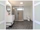 Modern bathroom with glass shower, hexagon tile floor and white vanity at 2704 E 24Th Ave, Tampa, FL 33605