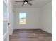 Spacious bedroom with ceiling fan and large window at 2704 E 24Th Ave, Tampa, FL 33605