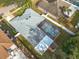 Aerial view of house with pool and screened enclosure at 2811 Windcrest Oaks Ct, Valrico, FL 33594