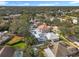 Aerial view of a residential area, highlighting a home with a pool at 2811 Windcrest Oaks Ct, Valrico, FL 33594