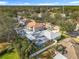 Aerial view of a home with a pool and lush landscaping at 2811 Windcrest Oaks Ct, Valrico, FL 33594