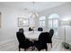 Elegant dining room featuring a round table and plantation shutters at 2811 Windcrest Oaks Ct, Valrico, FL 33594