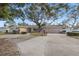Single-story home with circular driveway and mature landscaping at 289 Rafael Ne Blvd, St Petersburg, FL 33704