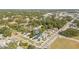 Aerial view of the home and neighboring houses, streets, and trees at 3006 E Columbus Dr, Tampa, FL 33605