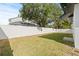 Fenced backyard with a grassy lawn, perfect for outdoor activities at 3006 E Columbus Dr, Tampa, FL 33605