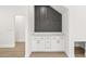 Modern bar with white cabinets, a marble countertop, and a wine rack at 3006 E Columbus Dr, Tampa, FL 33605