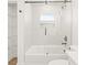 Modern bathroom with a glass-enclosed shower/tub combo and stylish fixtures at 3006 E Columbus Dr, Tampa, FL 33605