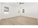 Bright and airy bedroom with large windows and wood-look flooring at 3006 E Columbus Dr, Tampa, FL 33605