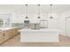 Sleek kitchen featuring white countertops, an island, and stainless steel appliances at 3006 E Columbus Dr, Tampa, FL 33605