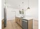 Modern kitchen with island, stainless steel appliances, and stylish light fixtures at 3006 E Columbus Dr, Tampa, FL 33605