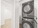 Laundry room with a stacked Samsung washer and dryer at 3006 E Columbus Dr, Tampa, FL 33605
