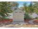 Tan colored storage shed in backyard at 4504 W Price Ave, Tampa, FL 33611