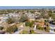 Bird's-eye view of the home and the surrounding neighborhood with trees and streets at 527 Fox Run Trl, Apollo Beach, FL 33572