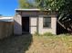 Outdoor storage shed with a window and double door at 6244 Fairway Blvd, Apollo Beach, FL 33572