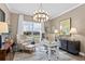 Home office with white desk, black cabinets, and large window at 6307 Pasadena Point Blvd, Gulfport, FL 33707