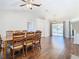 Bright dining room with wood floor, large table, and access to backyard at 6371 Shadydale Ave, Spring Hill, FL 34609