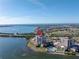 Aerial view of waterfront condo building with pool and parking at 6372 Palma Del Mar S Blvd # 505, St Petersburg, FL 33715