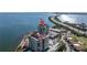 Aerial view of waterfront condo building with pool and parking at 6372 Palma Del Mar S Blvd # 505, St Petersburg, FL 33715