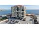 Aerial view of waterfront building with parking at 6372 Palma Del Mar S Blvd # 505, St Petersburg, FL 33715