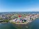 Aerial view of waterfront condo building with pool and parking at 6372 Palma Del Mar S Blvd # 505, St Petersburg, FL 33715