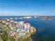 Aerial view of waterfront condo building with pool and parking at 6372 Palma Del Mar S Blvd # 505, St Petersburg, FL 33715