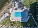 Aerial view of a community pool with surrounding lounge chairs and patio at 6372 Palma Del Mar S Blvd # 505, St Petersburg, FL 33715