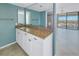 Bathroom vanity with granite countertop and view to living area at 6372 Palma Del Mar S Blvd # 505, St Petersburg, FL 33715